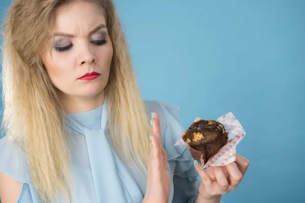 Skeptical Woman Holding Muffin Cupcake Dark Chocolate Flavour Having Disgusted — Stock Photo, Image