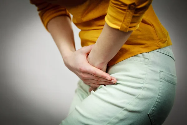 Part of body young sick woman with hands holding pressing her crotch lower abdomen. Medical or gynecological problems, healthcare concept — Stock Image Part Body Young Sick Woman Hands Holding Pressing Her Crotch Stock Photo