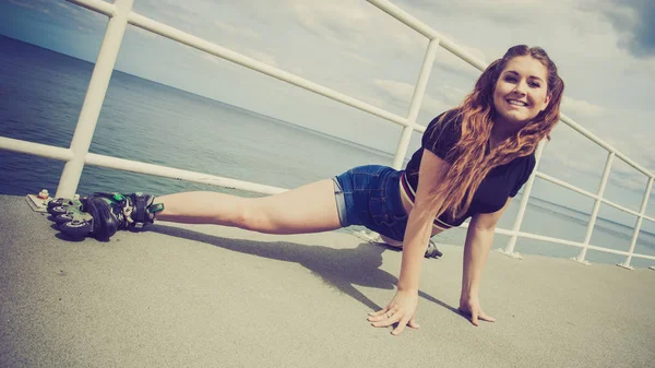 Happy Joyful Young Woman Wearing Roller Skates Fooling Stretching Her — Stock Photo, Image