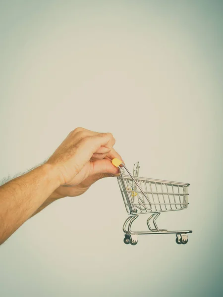 Male Hands Holding Empty Shopping Basket Cart Toned Image Seasonal — Stock Photo, Image