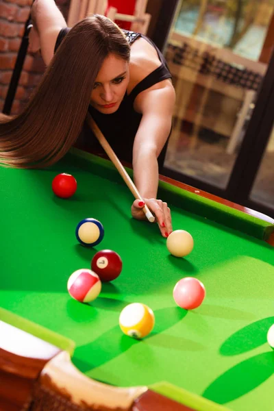 Premium Photo  Beautiful young girl came on a weekend to play billiards  for curiosity concept of a girl playing billiards