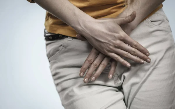 Closeup young sick woman with hands holding pressing her crotch lower abdomen. Medical or gynecological problems, healthcare concept — Stock Image Closeup Young Sick Woman Hands Holding Pressing Her Crotch Lower Stock Image