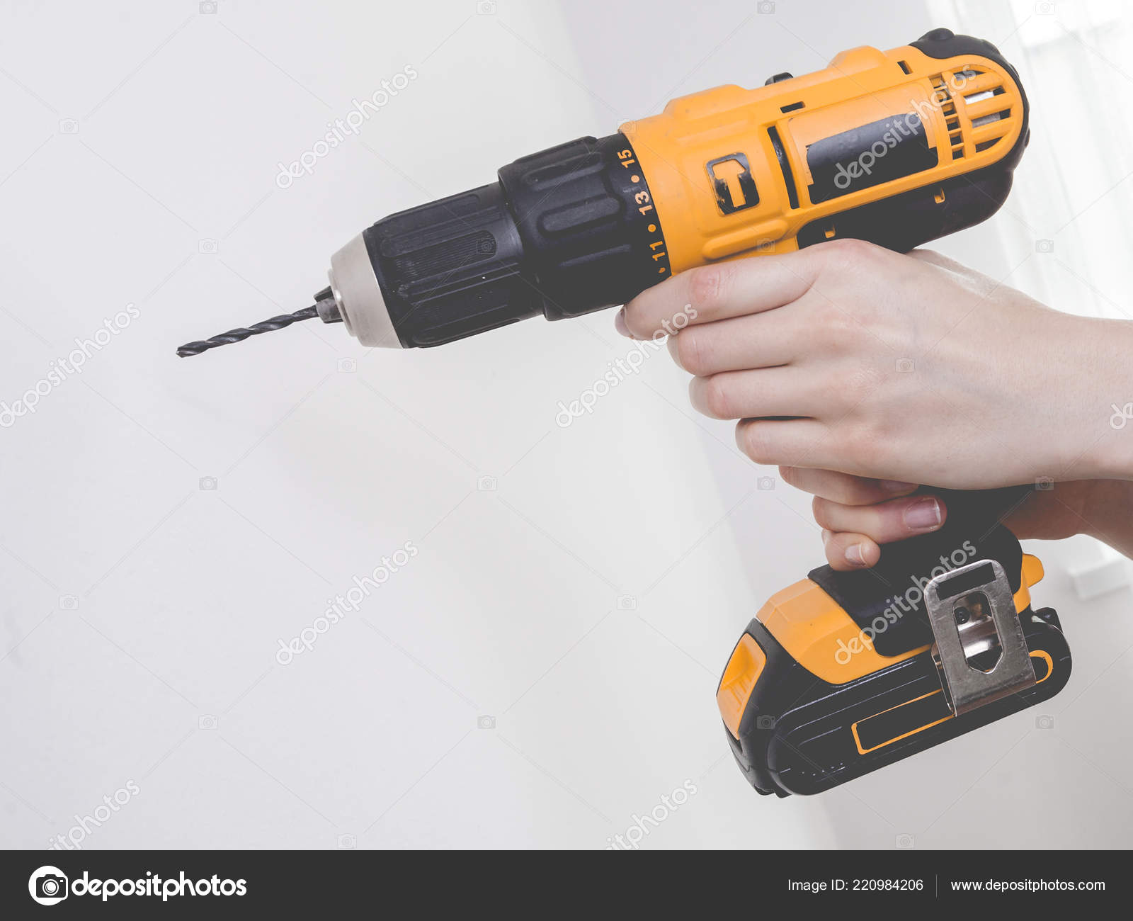 Unrecognizable Woman Holding Yellow Driller Drill Something