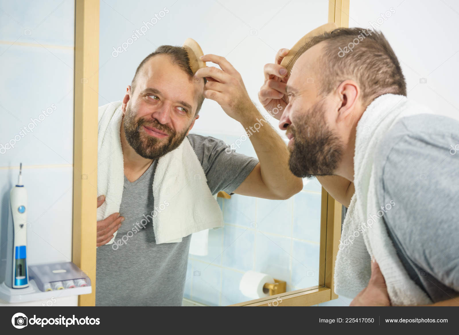 Adult Man Standing Front Bathroom Mirror Brushing His Short Hair
