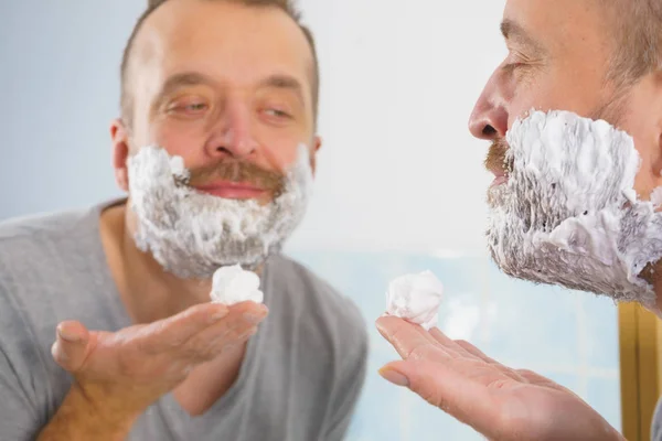 Man Applying Shaving Foam Cream His Face Standing Bathroom Looking — Stock Photo, Image