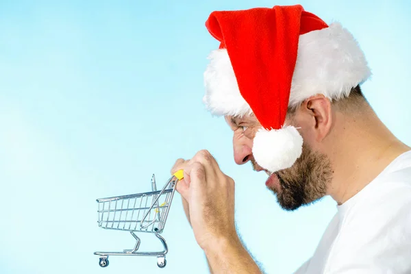 Man Wearing Santa Claus Hat Holding Empty Shopping Basket Cart — Stock Photo, Image