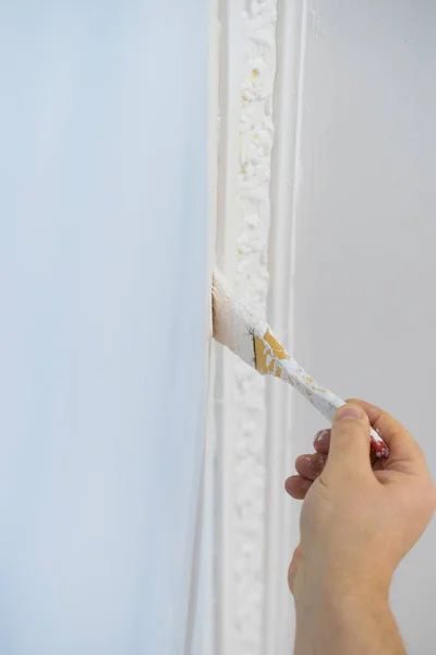 Person Appplying White Paint Blue Wall Using Brush Home Renovation — Stock Photo, Image