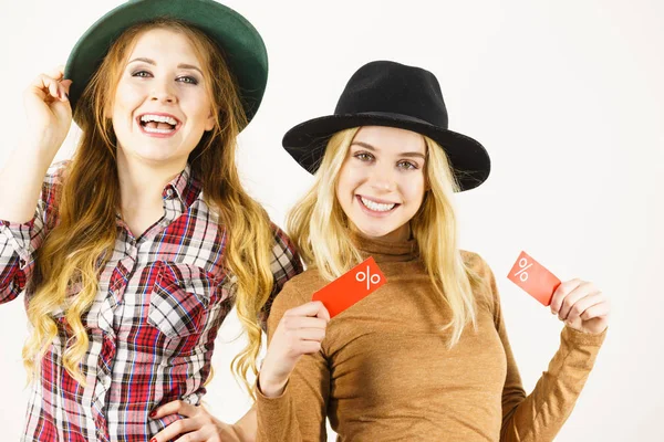 Female Friends Shopping Showing Tag Sale Percentage Sign Enjoying Cheap — Stock Photo, Image