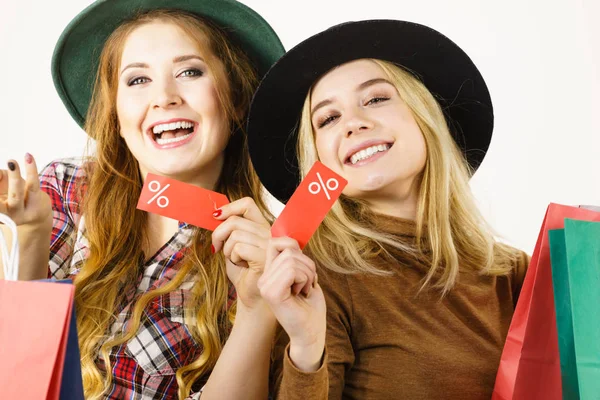 Female Friends Shopping Showing Tag Sale Percentage Sign Enjoying Cheap — Stock Photo, Image