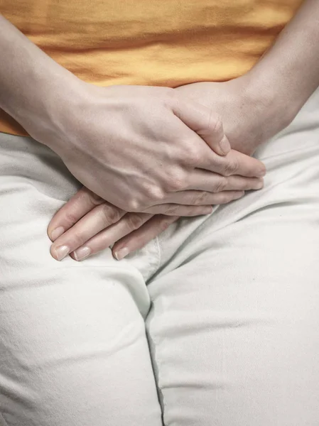Closeup young sick woman with hands holding pressing her crotch lower abdomen. Medical or gynecological problems, healthcare concept — Stock Image Closeup Young Sick Woman Hands Holding Pressing Her Crotch Lower Stock Image