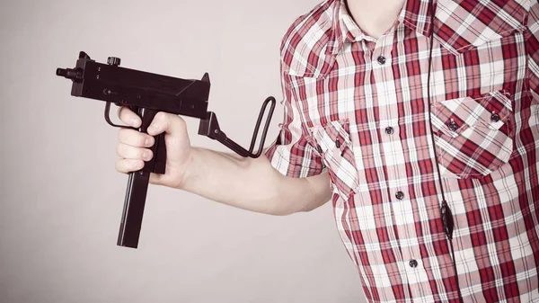 Unrecognizable Man Holding Weapon Black Machine Gun Gray Background Dangerous — Stock Photo, Image