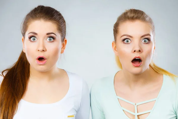 Two shocked and amazed women