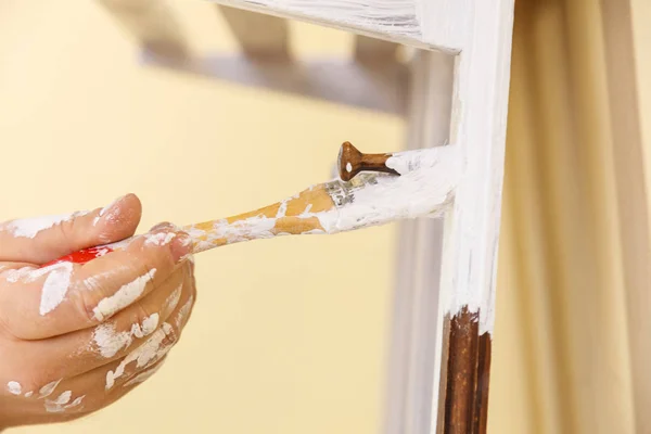 Person renovating wooden hanger — Stock Photo, Image