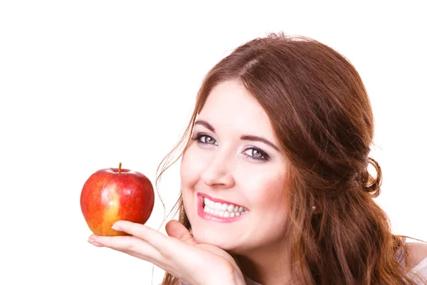 Woman holds apple fruit close to face, isolated — Stock Photo, Image