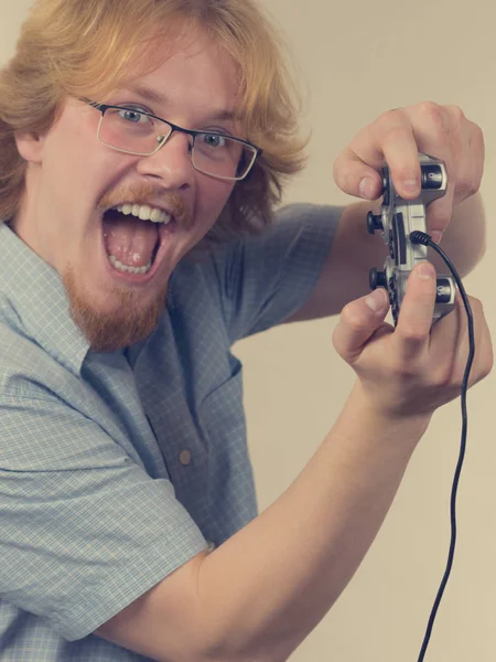 Gamer man holding gaming pad — Stock Photo, Image