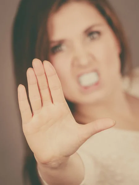 Angry apodicticity woman showing stop with hand — Stock Photo, Image