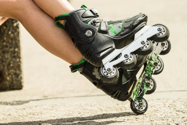Woman legs wearing roller skates — Stock Photo, Image