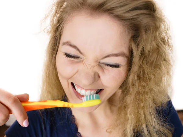 Happy positive woman brushing teeth, isolated — Stock Photo, Image