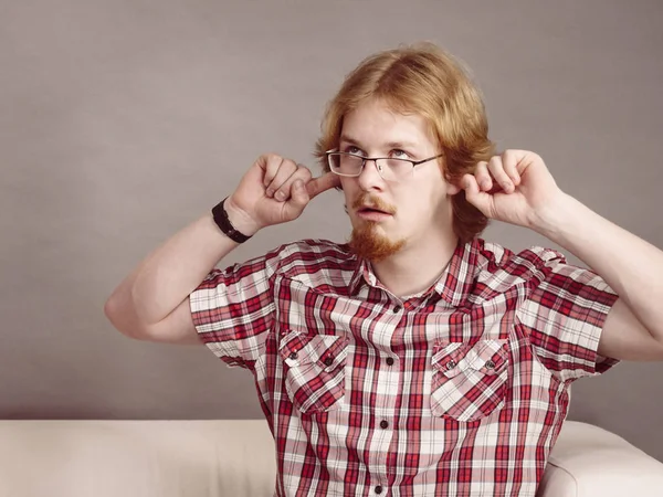 Man being annoyed with noise — Stock Photo, Image