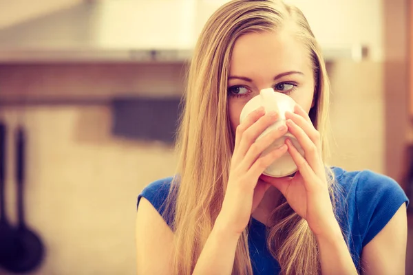 Woman holding cup of tea of coffee — Stock Photo, Image