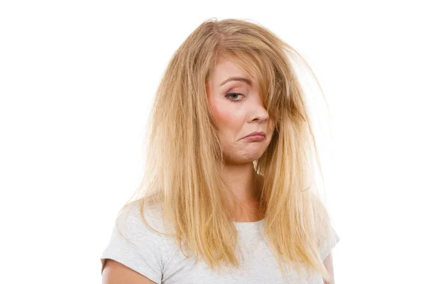 Sad blonde woman with messy hair Royalty Free Stock Images