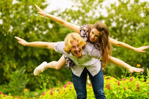 Happy couple playing in park — Stock Photo, Image