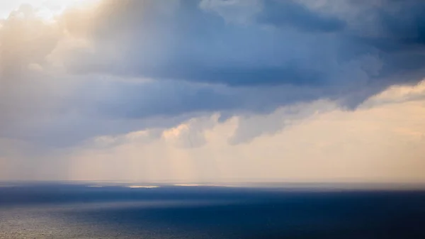 Dark storm rainy clouds on sea — Stock Photo, Image