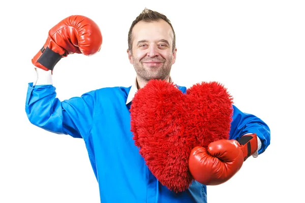 Homem com luvas de boxe segurando coração — Fotografia de Stock