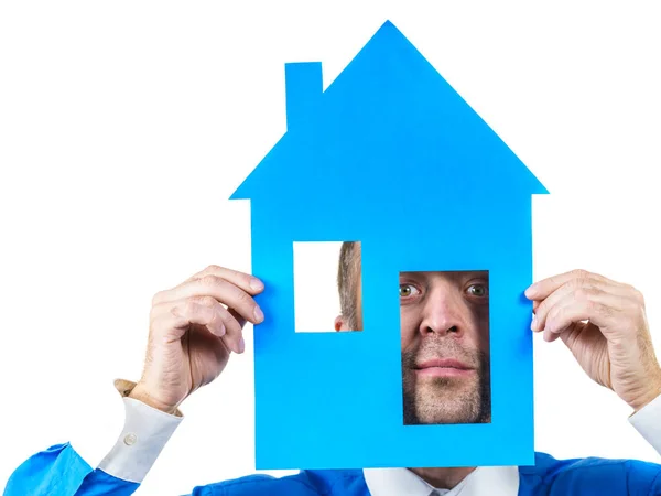 Man holding blue house model — Stock Photo, Image