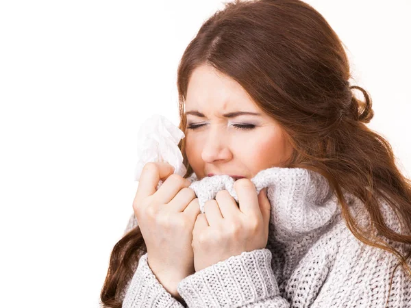 Sick freezing woman sneezing in tissue — Stock Photo, Image