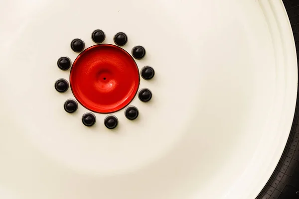 Close up of red detailed black bolts — Stock Photo, Image