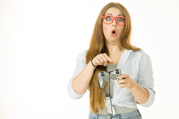 Woman trying to understand gaming pad — Stock Photo, Image
