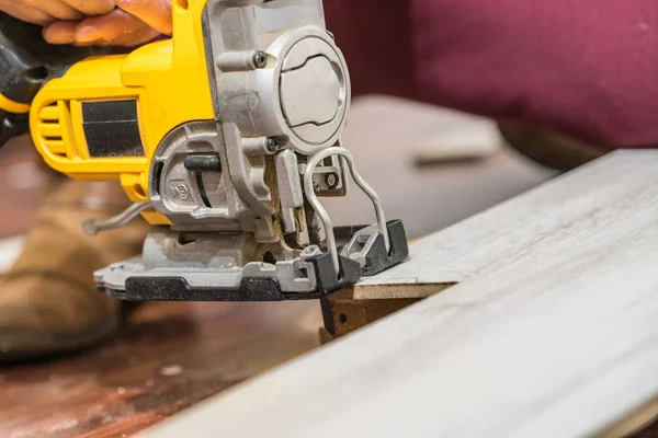 Person cutting floor panels — Stock Photo, Image