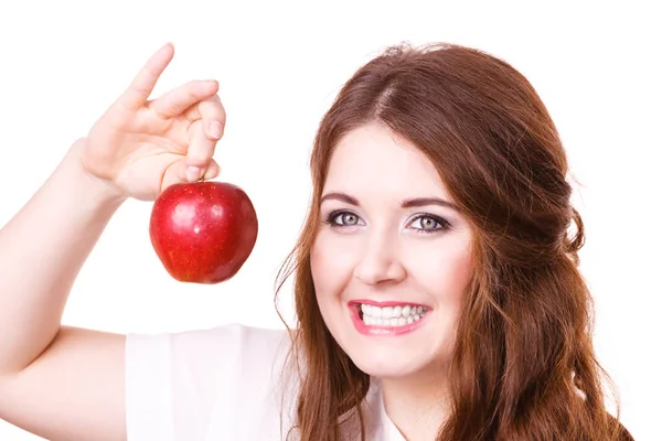 Woman holds apple fruit close to face, isolated — Stock Photo, Image