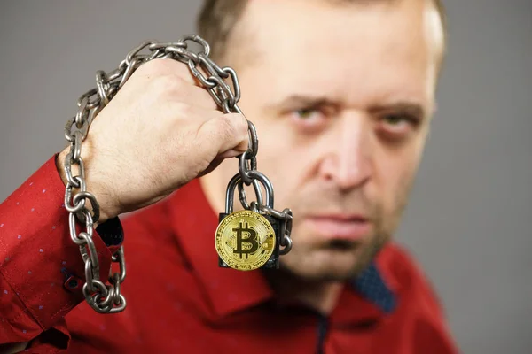 Man being tied up in block chain — Stock Photo, Image