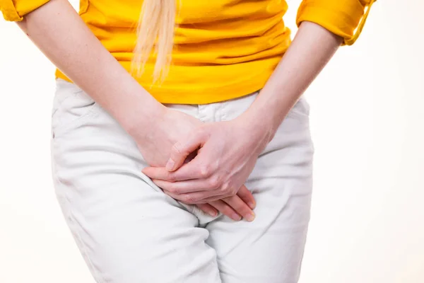Woman with hands holding her crotch — Stock Image Woman with hands holding her crotch Royalty Free Stock Photos