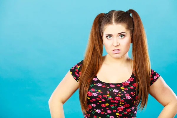 Angry teenager girl with brown hair ponytails — Stock Photo, Image