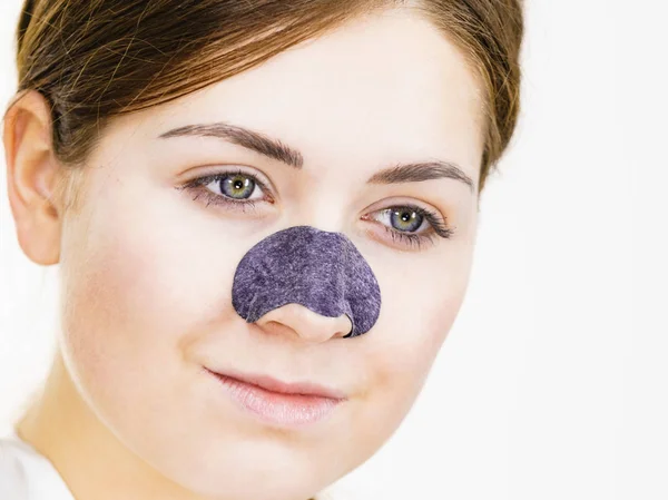 Woman applying pore strips on nose — Stock Photo, Image