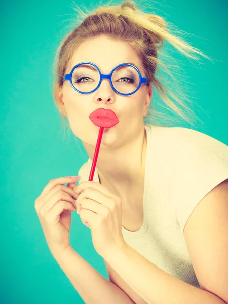 Happy woman holding fake lips on stick — Stock Photo, Image