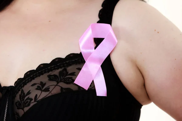 Woman chest in bra, pink cancer ribbon — Stock Photo, Image