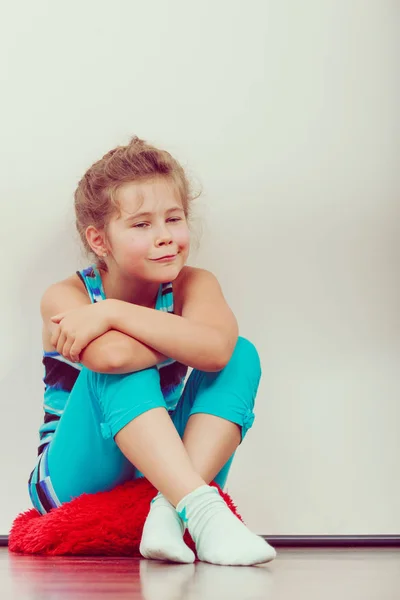 Happy joyful little girl kid sitting on pillow. — Stock Photo, Image