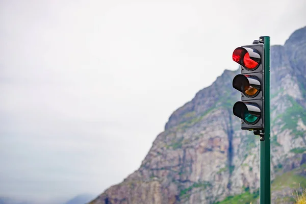 Red traffic lights against mountains — Stock Photo, Image