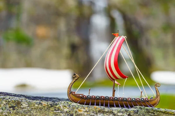 Viking boat on fjord shore, Norway