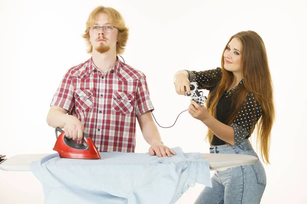 Woman controling man to do ironing — Stock Photo, Image