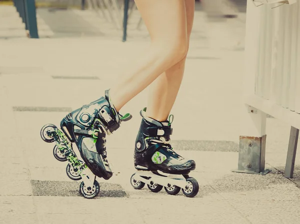 Woman legs wearing roller skates — Stock Photo, Image