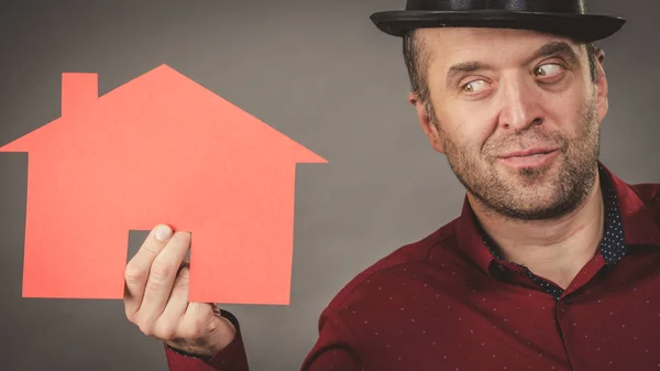 Man holding red house model — Stock Photo, Image