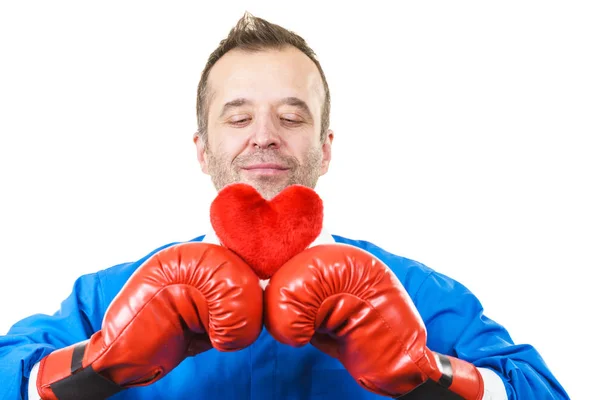 Man with boxing gloves holding heart — Stock Photo, Image