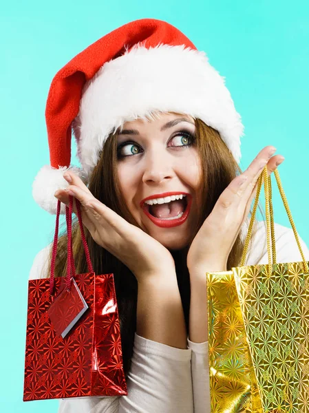 Happy Christmas woman holds gifts bag — Stock Photo, Image
