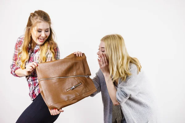 Two women being excited about brown skirt — Stock Photo, Image