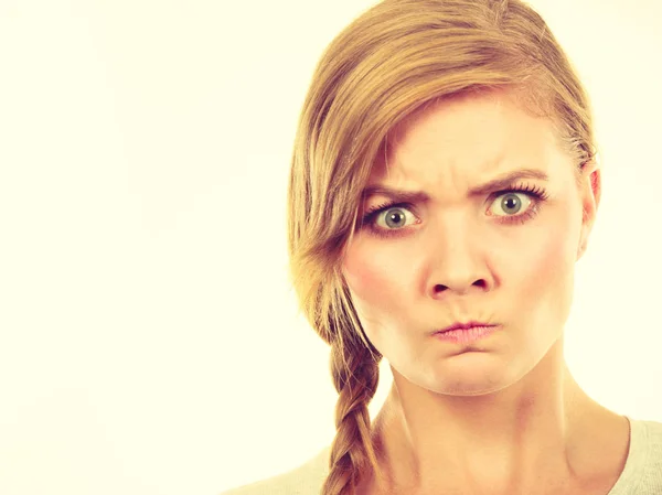 Teenage girl in braid hair making angry face — Stock Photo, Image